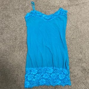 Blue tank top with lace on the bottom and top